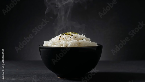 Simple Bowl Composition with White Rice, Steaming, and Dark Background, Minimal Contrast.