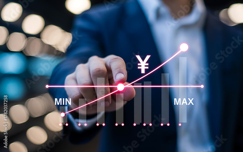 Businessman pointing at a financial graph with japanese yen symbol indicating growth and profit, representing investment and economic success