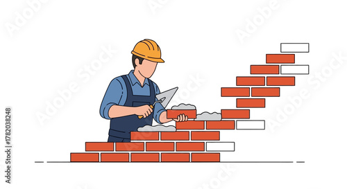 A construction worker builds a brick wall with a trowel