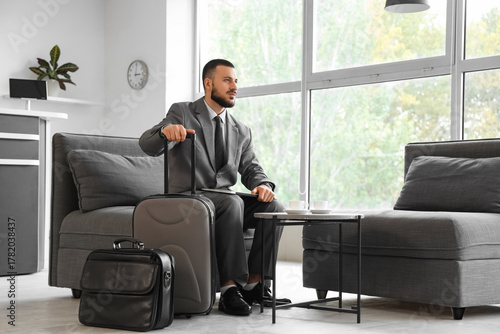 Young businessman with lapt...