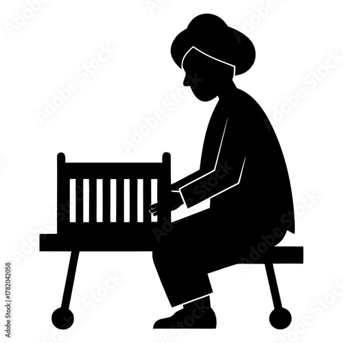 Siliguri street musician playing harmonium in artistic silhouette