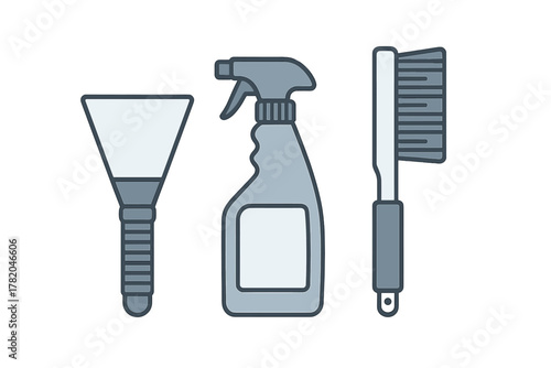 Essential household cleaning supplies set with spray bottle, scraper, and scrubbing brush