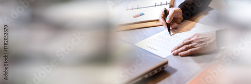 Cuadro en lienzo Senior businessman reviewing terms of contract; panoramic banner