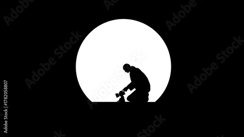 Creative photographer silhouette kneeling with camera, capturing a scene against a dramatic bright circle of light on a dark background.