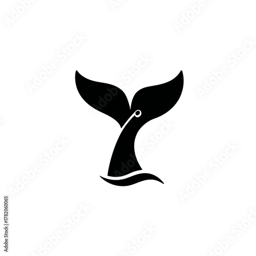 Elegant black whale tail silhouette emerging from ocean waves. Stylized vector illustration of a marine animal fluke.