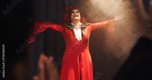 Obraz na płótnie Person, drag artist and stage with applause, praise and excited with thanks for crowd at cabaret show