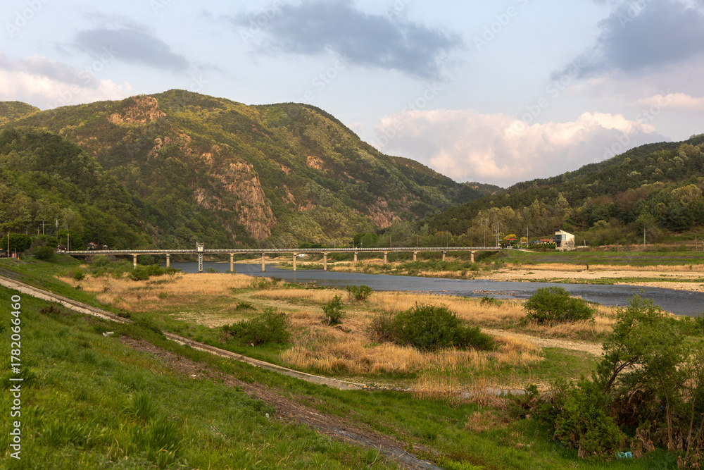 Naklejka premium landscape with river and mountains