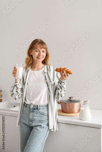 Young woman with glass of m...