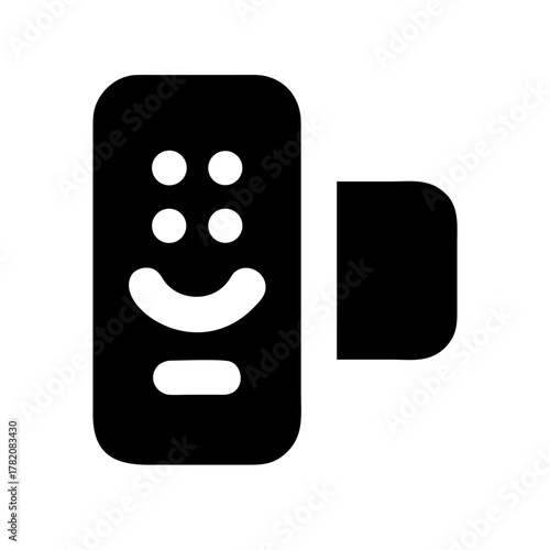 A close up of a black and white cat s face with striking green eyes