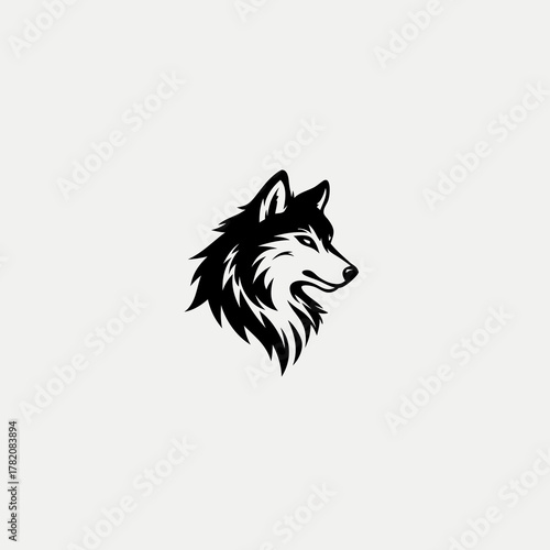 Powerful black and white vector illustration of a wolf's head in profile, representing strength, wilderness, and animal spirit.
