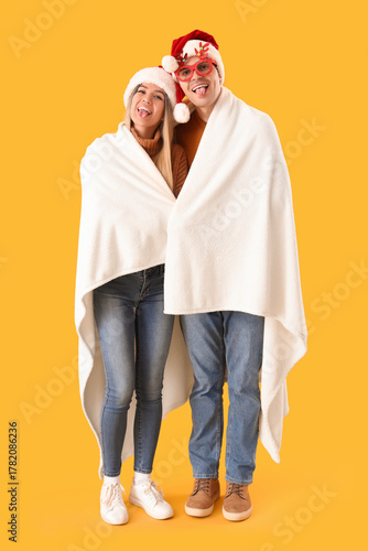 Happy young couple in Santa...