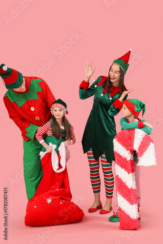 Happy family in elf's costu...
