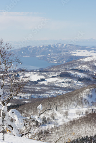 View of Lake Toya winter landscape from mountain peak, Hokkaido, Japan