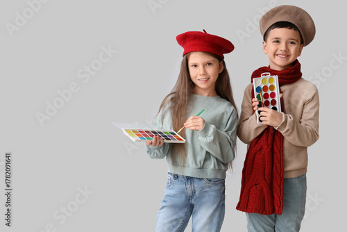 Cute little artists with pa...