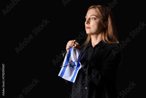 Mature woman with flag of I...