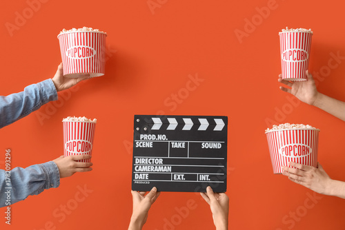 Hands with movie clapper an...