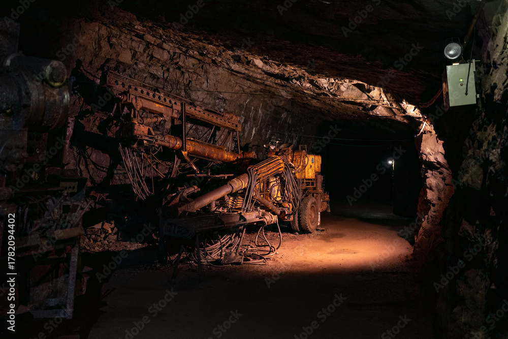Fototapeta premium Old drilling jumbo in underground mine