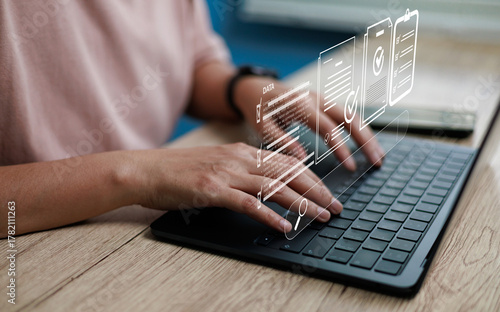 Hands typing on laptop with hologram digital search data interface, representing online document management, data processing, workflow automation, and modern technology digital business