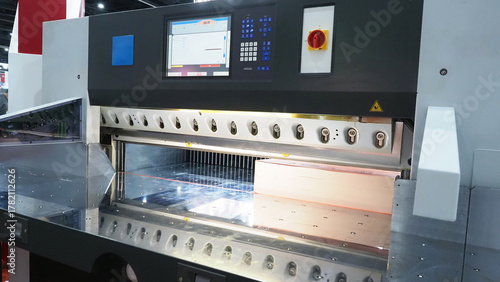 An industrial paper cutting machine equipped with a digital control panel