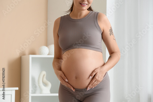 Sporty young pregnant woman...