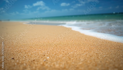 Fototapeta Naklejka Na Ścianę i Meble -  Tropical sandy beach with blurred sea and sky, ideal for relaxation