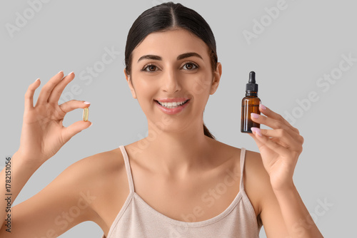 Young woman with vitamin E ...