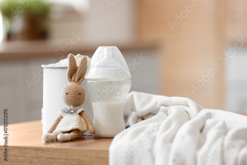 Bottle with baby milk formu...