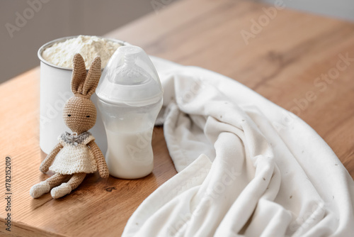 Bottle with baby milk formu...