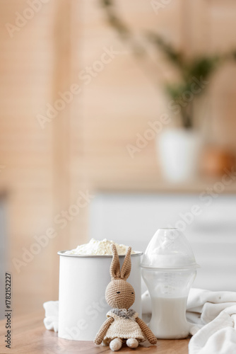 Bottle with baby milk formu...