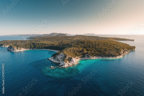 Fototapeta Naklejka Na Ścianę i Meble -  Top-down drone shot of a stunning coastal peninsula known for its unique shape and charm.