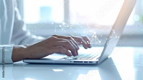 Person typing on laptop with digital network overlay, representing global business and technology.
