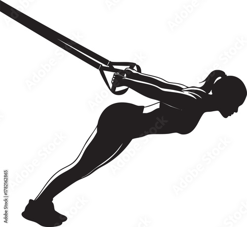A black silhouette of a woman is shown performing an exercise using suspension trainers, highlighting her athletic physique and dedication to fitness.