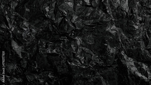 Crumpled plastic surface showing irregular folds, suitable for industrial packaging backgrounds