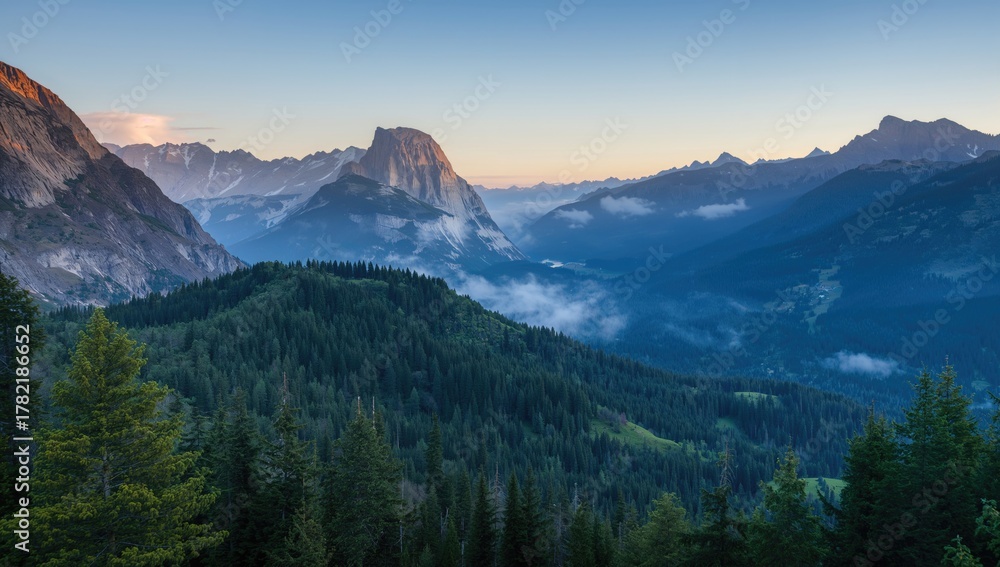 Obraz premium Aerial view of majestic mountains and forests, showcasing natural beauty and seasonal change