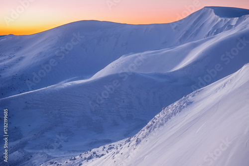 magical sunrise on a mountain peak. snowy Mountain peaks. fairytale calming landscape