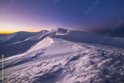 magical sunrise on a mountain peak. snowy Mountain peaks. fairytale calming landscape