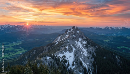 Fototapeta Naklejka Na Ścianę i Meble -  A panoramic view of Rysy peak in Tatra Mountains during sunset, showcasing seasonal change