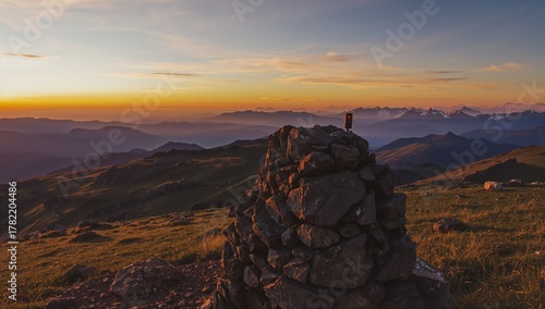 Fototapeta Naklejka Na Ścianę i Meble -  Kasprowy Wierch peak with weather station instruments at sunset, showcasing the panoramic view of the High Tatra mountain range