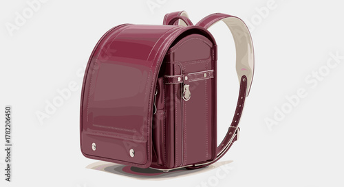Elegant burgundy randoseru school bag, a traditional Japanese backpack, showcasing meticulous stitching and a classic buckle closure, perfect for students and a symbol of educational journeys