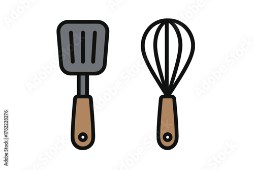 Set of essential kitchen utensils featuring a slotted spatula and a wire whisk