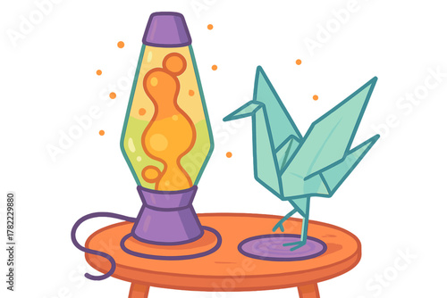 Colorful retro lava lamp and origami crane sculpture on a round orange table