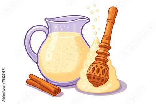 Creamy Lassi drink in a glass pitcher with a wooden mathani whisk and cinnamon sticks