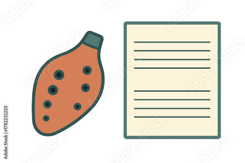 Traditional clay ocarina musical instrument resting beside blank lined paper