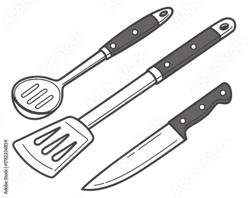 Kitchen utensils, including spoon, spatula, and knife