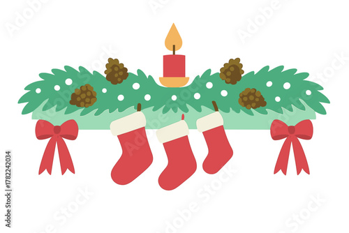 Holiday mantel decoration with green pine branches, burning candle, and three hanging red stockings
