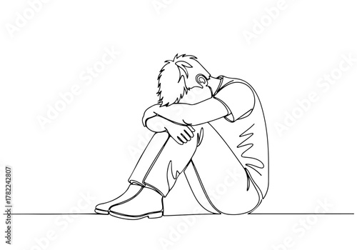 Continuous line drawing sketch art of a person sitting in a fetal position, mental health concept