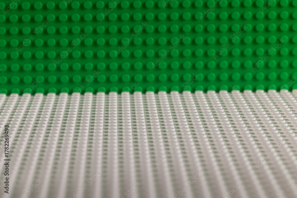 Obraz premium Green and White LEGO Baseplates Building Background Perspective