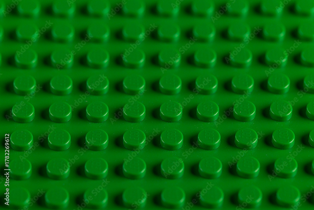 Obraz premium Vibrant Green LEGO Baseplate Top View Seamless Pattern