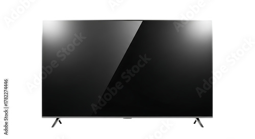 Isolated view of a modern flat screen television with a reflective screen on a black background