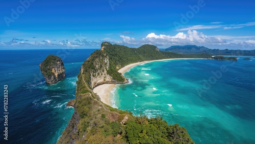 Fototapeta Naklejka Na Ścianę i Meble -  Aerial perspective of turquoise waters, rocky cliffs, and natural landscape at a tropical beach